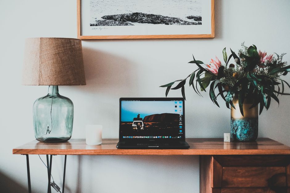 A tidy, comfortable desk setup with a laptop